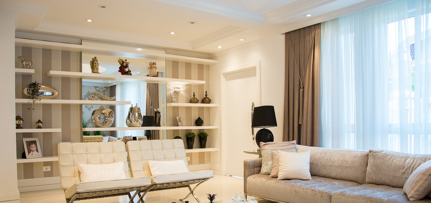 Living room with custom painted built-in shelving